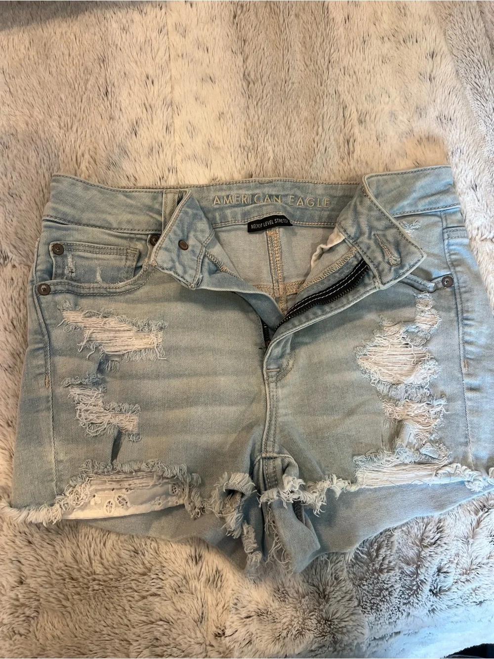 American Eagle Outfitters Nexxt Level Stretch Light Blue Distressed Denim Shorts